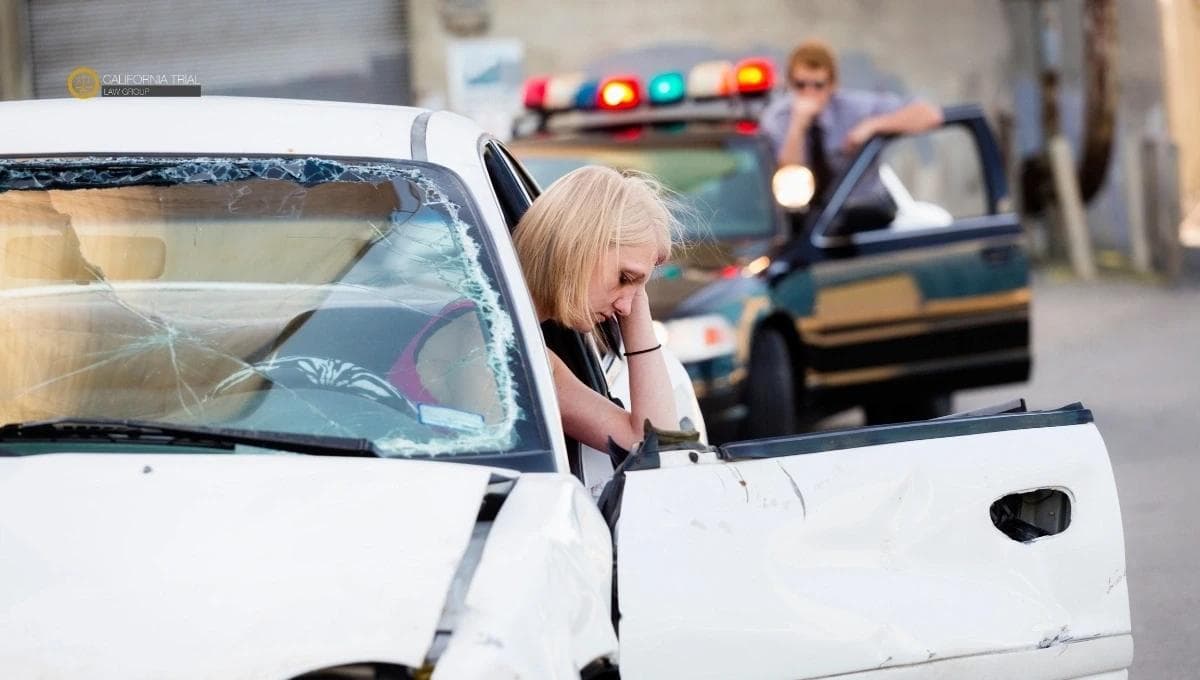 A women getting out of the car after accident