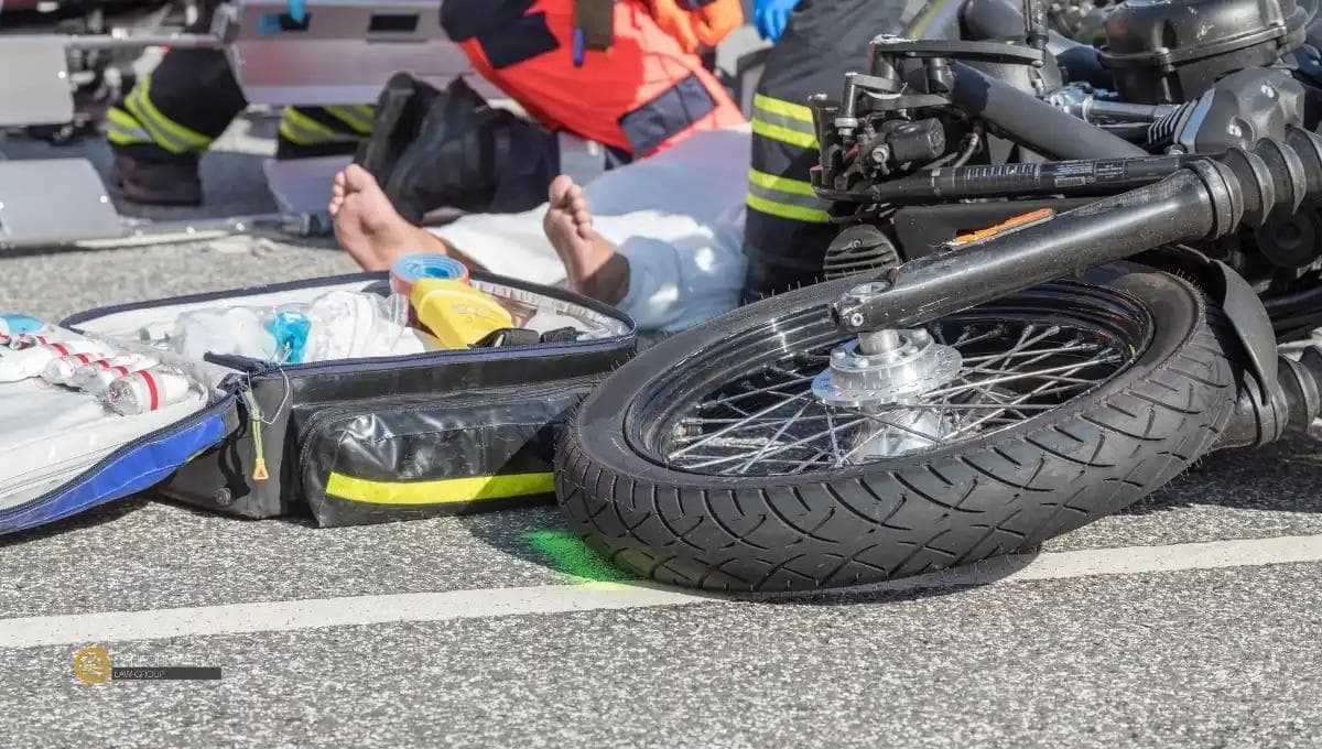 motorcycle rider geting medical treatment after an accident