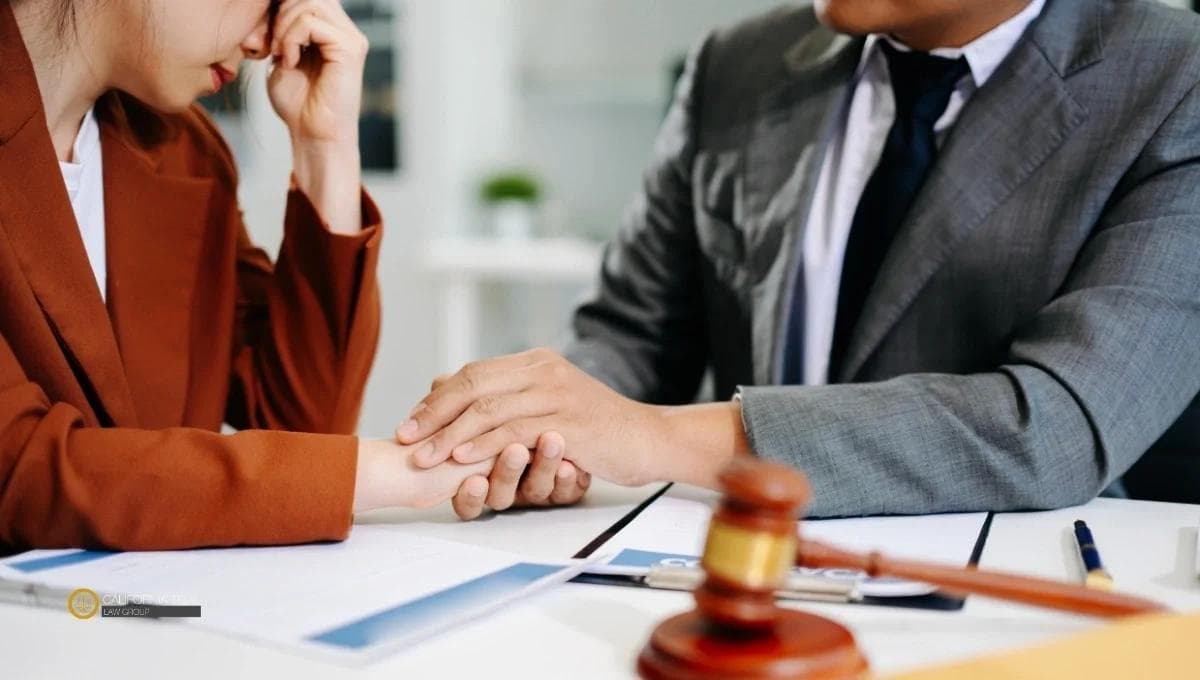 Attorney comforting grieving client during wrongful death consultation